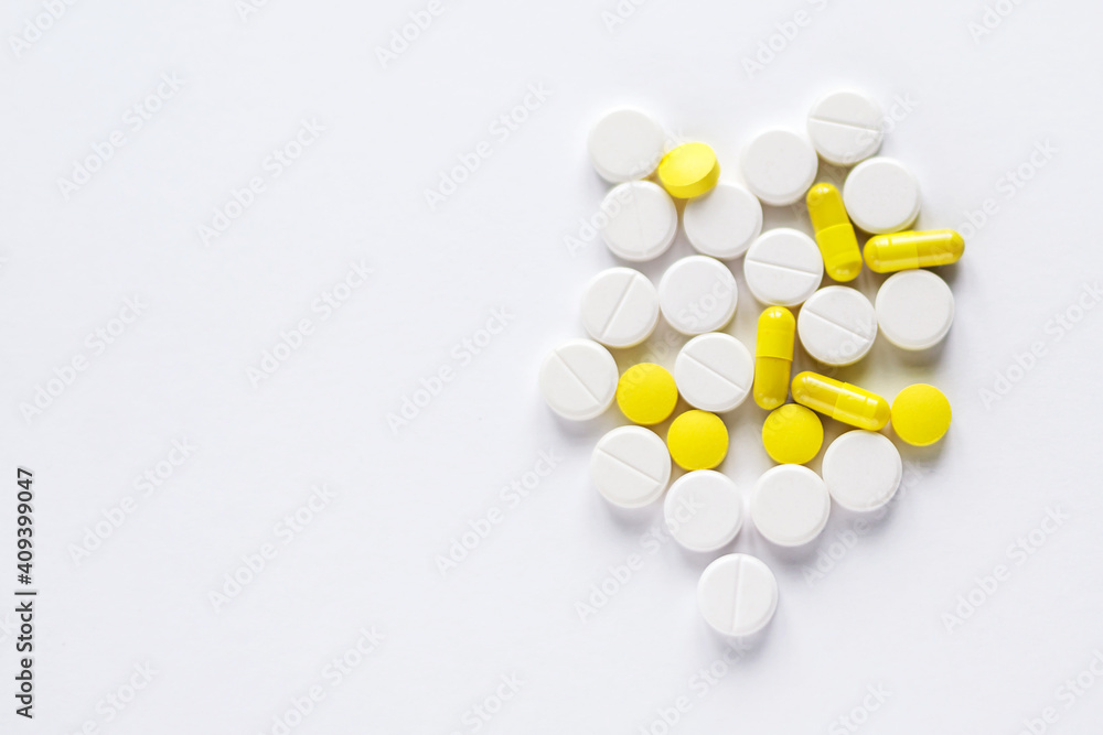 white pill smedicine macro - medical background, closeup of yellow, white pills