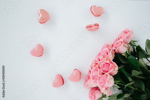 Heart shaped macaroons with pink flowers and roses