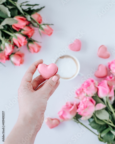 Heart shaped macaroon with coffee and pink roses