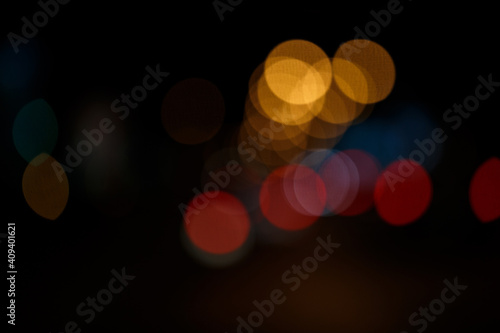Abstract defocused bokeh lights background. Night city street © natrot