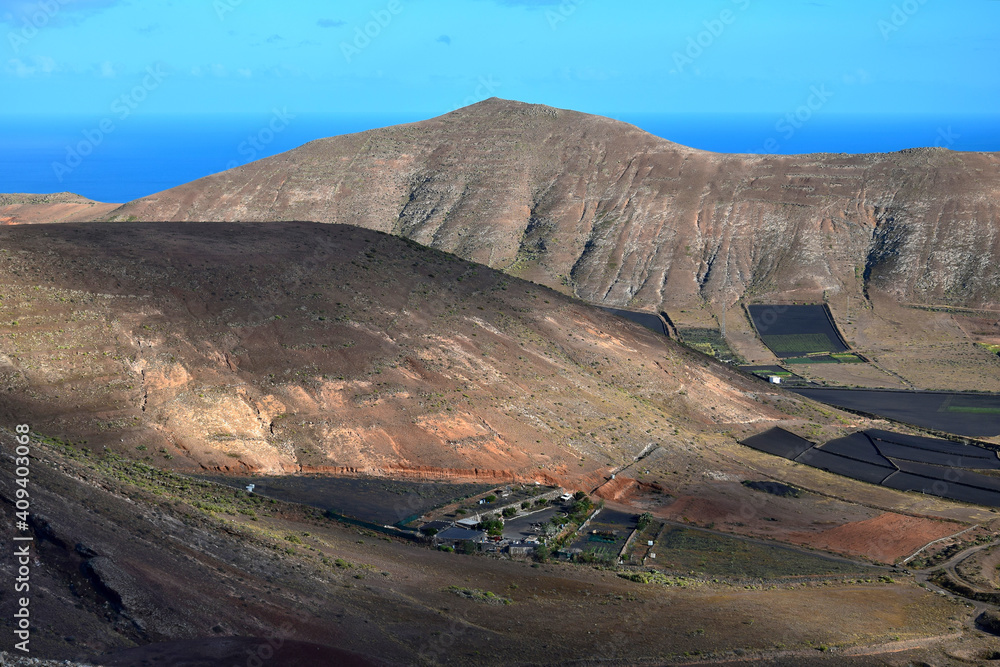 View to a valley and the Los Ajaches mountains near Femes. Lanzarote, Spain.