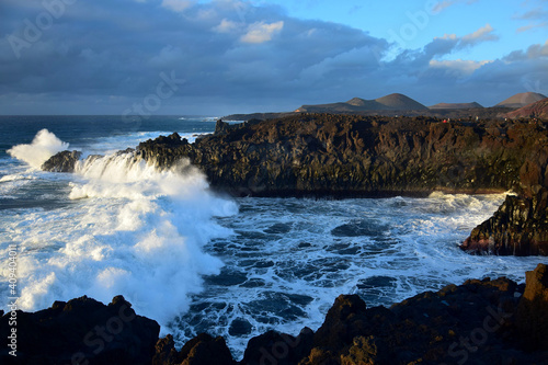 High waves at Los Hervideros in the evening sun. West coast of Lanzarote  Spain.