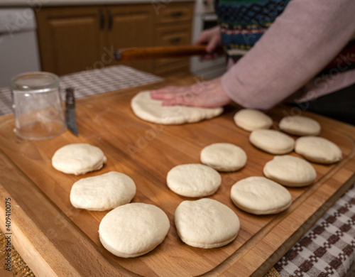 Woman making dough balls