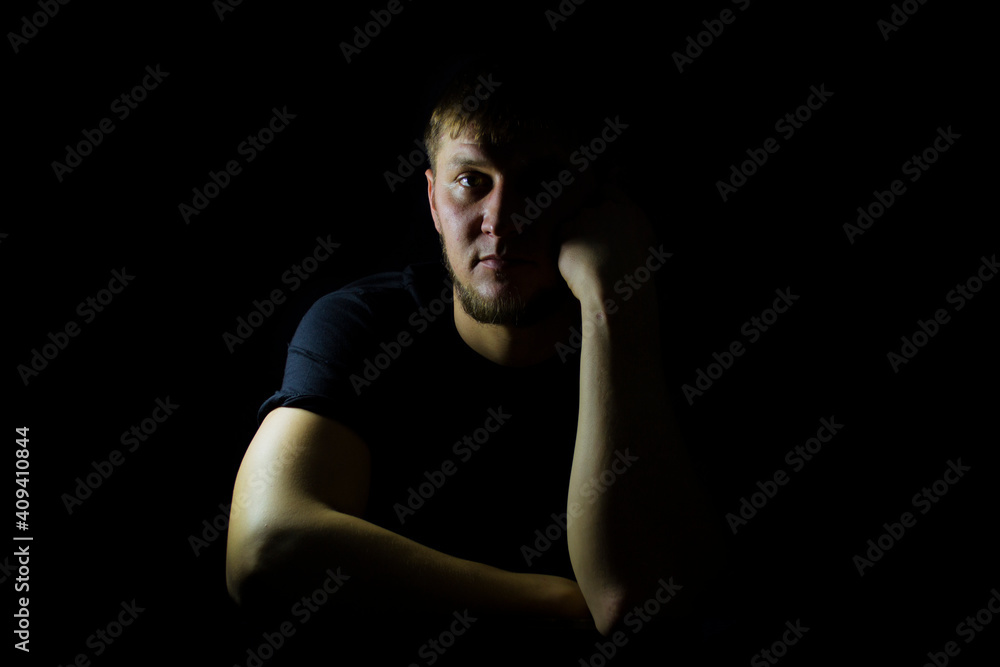 Fototapeta premium The guy on a dark background, the guy with the beard.