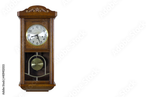 Antique pendulum wall clock isolated on white background