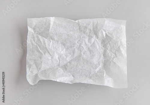 crumpled sheet of white baking paper