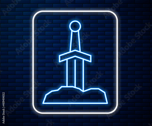 Glowing neon line Sword in the stone icon isolated on brick wall background. Excalibur the sword in the stone from the Arthurian legends. Vector.