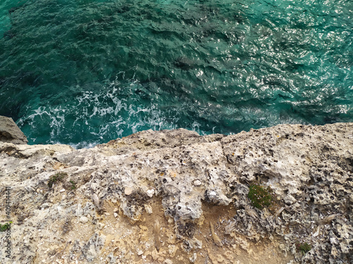 contrast between rock and sea colliding in it