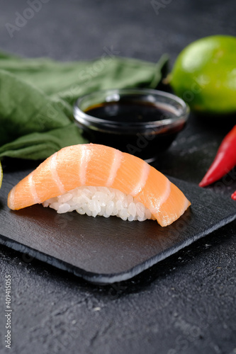 Sushi with salmon on a black background