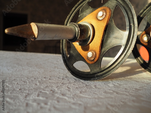 Poles. Sports equipment used by skiers, climbers, tourists to maintain balance and accelerate movement while skiing. Round rings with leather inserts to prevent the stick from falling into the snow photo