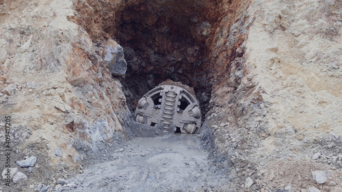 Front view of small tunnel boring machine on construction site. 