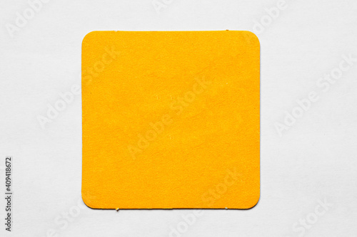 Old used coaster or bottle pad. For beer or other drinks, isolated. Add your own design, message or logo.
