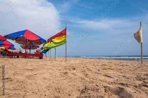 A beach without tourists and with flags from different countries Accra Ghana West Africa