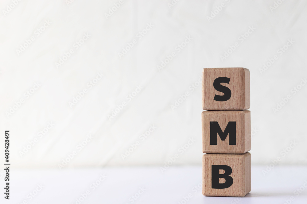 Text SMB on wood cubes. Abbreviation of 'Server Message Block' or 'Small and medium-sized enterprises'. Text SMB on wood cubes. Abbreviation of 'Server Message Block' or 'Small and medium-sized enterprises'.