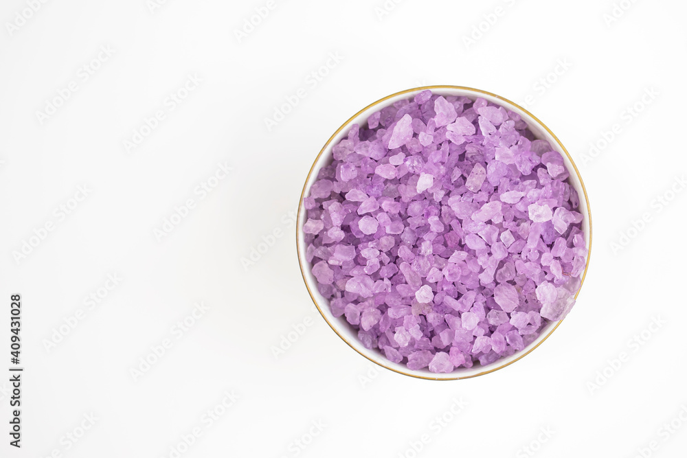 Lavender salt close-up on white background. Body treatment, skin care concept. Flat lay. Lavender salt close-up on white background. Body treatment, skin care concept. Flat lay.