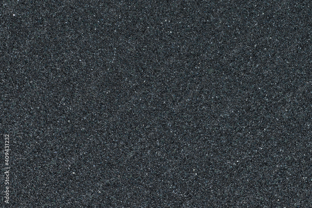 Full frame of black sandpaper texture. Abrasive material with a gritty surface Full frame of black sandpaper texture. Abrasive material with a gritty surface