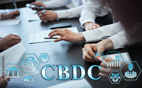 Business management concept - group of businessmen in office with digital business icons, graphic banner showing symbol of banking, commercial assistance. Inscription: CBDC photo