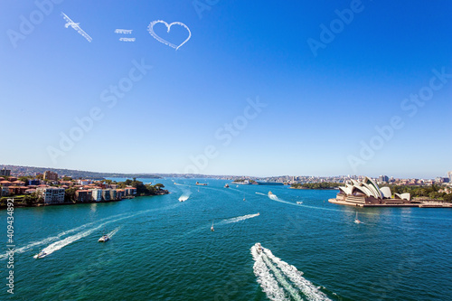 Photography Funny airplane trail over Sydney port