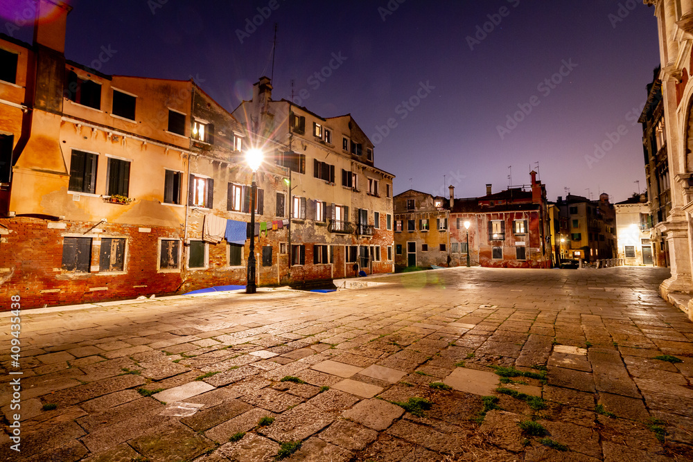 Night view of canal in Venice, Italy. Architecture and landmarks of Venice. Night life of Venice. Venice postcard with night canal. 