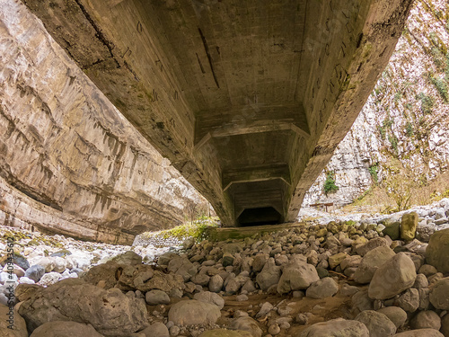 man alone in the mountains. yupsharskiy canyon (yupsharskiye vorota) in abkhazia. Iupshara River. photo