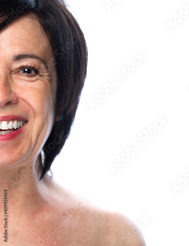 Beauty portrait of a senior woman laughing on a white background - Isolated mature lady smiling on a white background photo