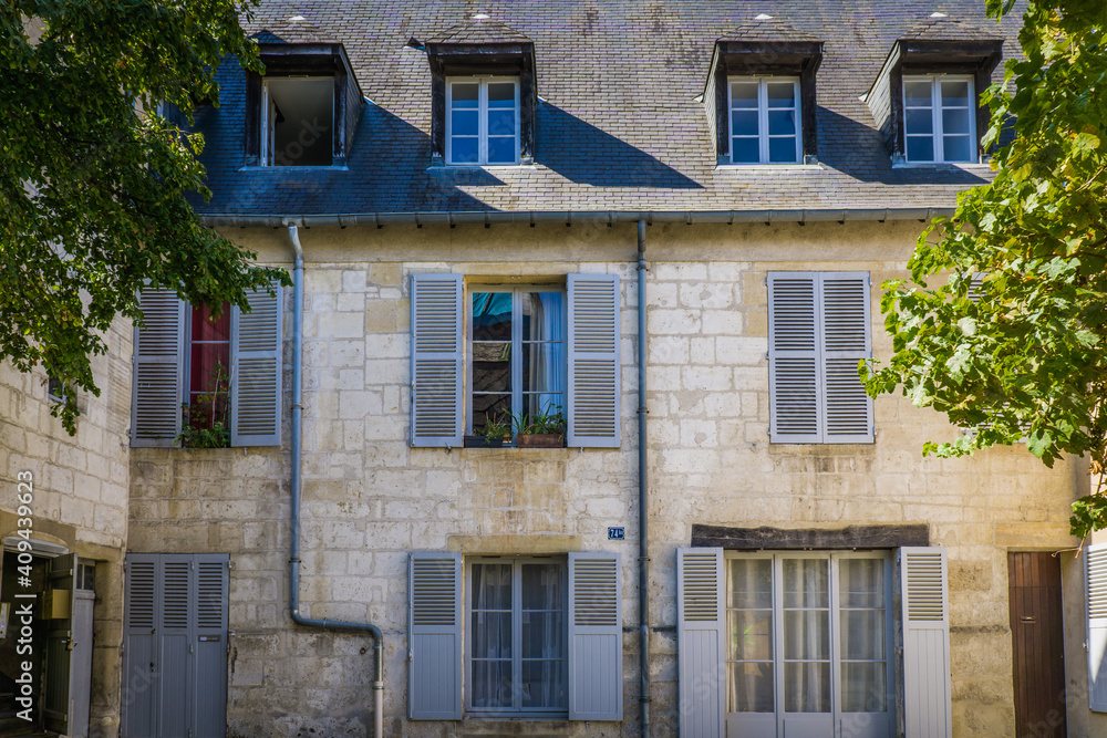 Naklejka premium Cute townhouse facade in the historic center of Bourges, a city located in the Berry Region of France