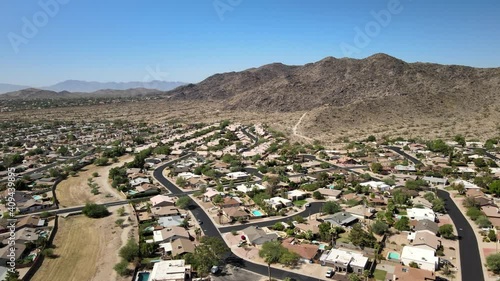 Drone flyover of Ahwatukee homes during sunny day photo