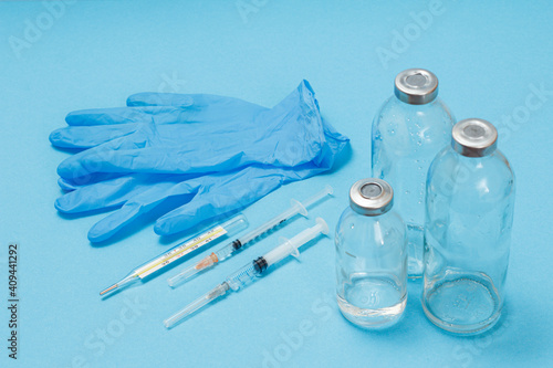 Wallpaper Mural Medical syringes, gloves and bottles for liquid medicine. Torontodigital.ca