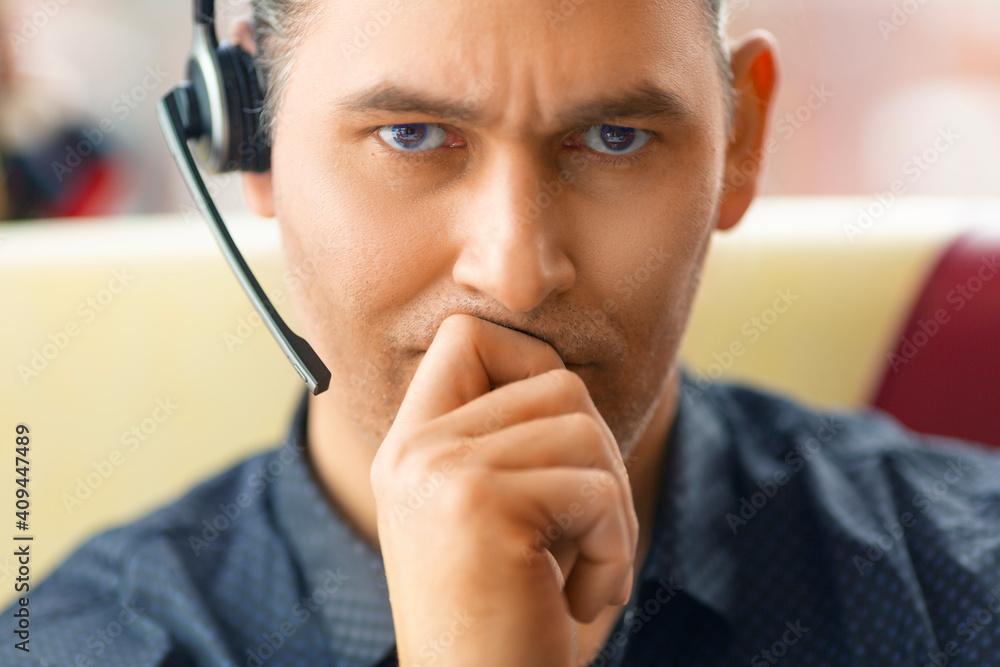 Close-up portrait of a human with a headset. Close-up portrait of a human with a headset.