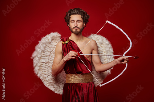 Cupid with bow and arrow photo