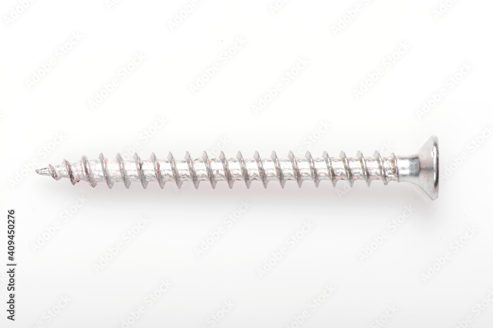 Long self tapping iron screw, macro close-up isolated on white background, banner size. Long self tapping iron screw, macro close-up isolated on white background, banner size.