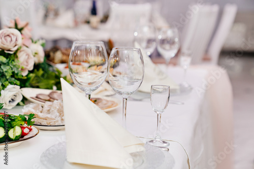 empty wine glasses. serving a table for celebration in a cafe or restaurant. Banquet. © Maria