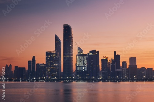 Urban skyline with skyscrapers at beautiful dawn. Cityscape Abu Dhabi, United Arab Emirates. 