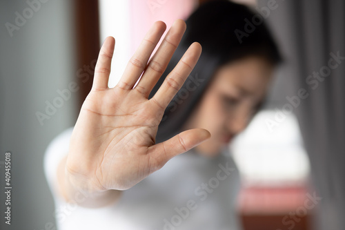 Leinwand Poster rejecting woman saying stop, no, halt with hand gesture