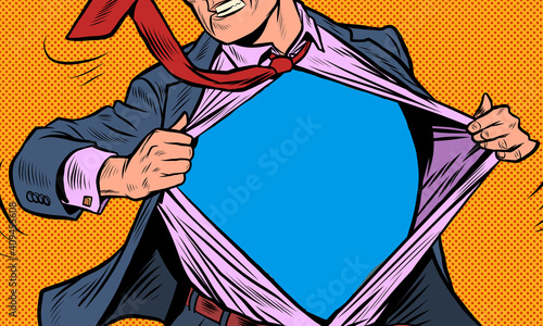 Superhero businessman tearing the suit photo