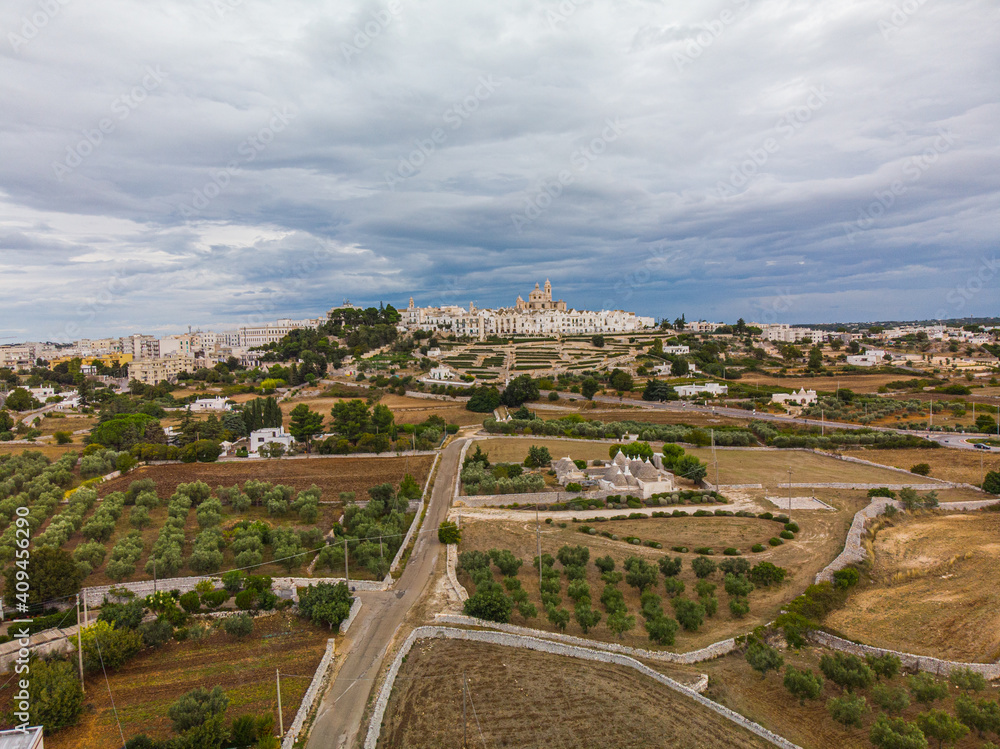 View of Locorotondo in Apulia from the air with a cloudy sky