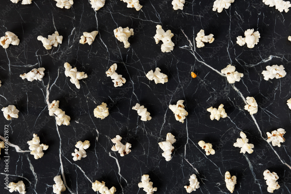 Popcorn pattern on black background. Stand out tolererance minimal concept Popcorn pattern on black background. Stand out tolererance minimal concept