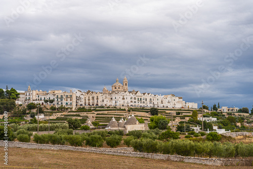 View of the skyline of Locortondo in Puglia from an olive tree field © Julia Hermann