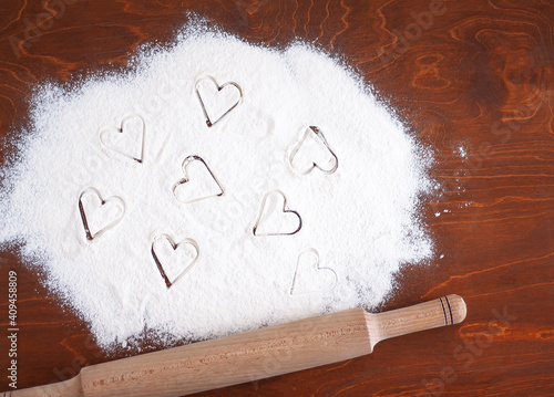 small hearts on flour and rolling pin
