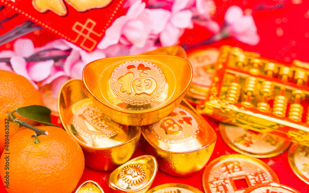 Chinese new year ornament--gold ingot and golden abacus,Chinese calligraphy on gold ingot translation:good bless for new year,Chinese characters on gold coin translation: good bless for money.