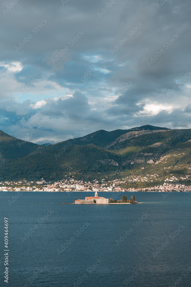 Beautiful landscape with a medieval church on an island in the sea in Montenegro