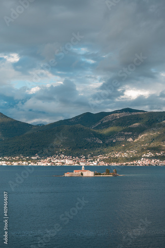 Beautiful landscape with a medieval church on an island in the sea in Montenegro