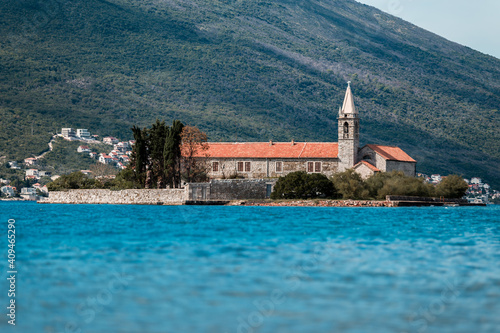 Beautiful view from the water to the Medieval Church in Montenegro. Island Gospa od Milosti in Montenegro