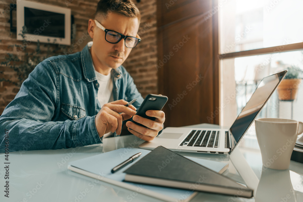 Man pointing on smartphone screen, chatting in social networks, meeting website, searching internet, using text messenger or online banking. Close up of male hands. Remote work Man pointing on smartphone screen, chatting in social networks, meeting website, searching internet, using text messenger or online banking. Close up of male hands. Remote work