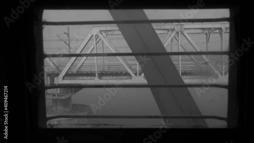 Views of a railway bridge from a moving train.