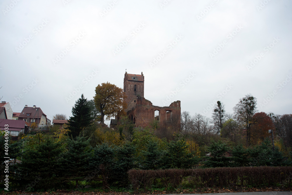 Gerdauen Castle in the Kaliningrad region, the medieval central gate in the autumn season. Gerdauen Castle in the Kaliningrad region, the medieval central gate in the autumn season.