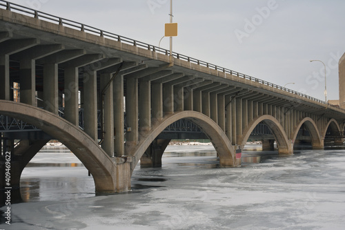 bridge over the river in winter photo
