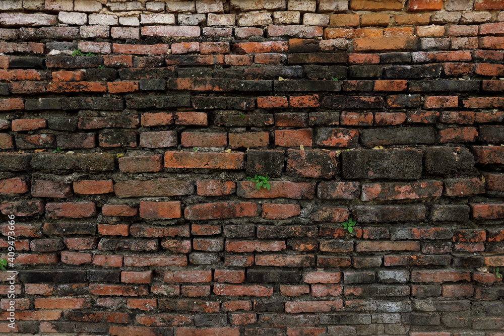 Fototapeta premium Ancient red brick wall vintage building