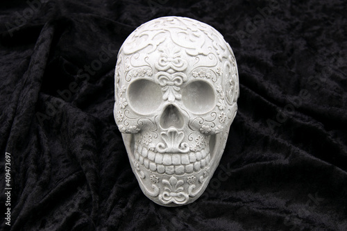 Skull on black velvet texture