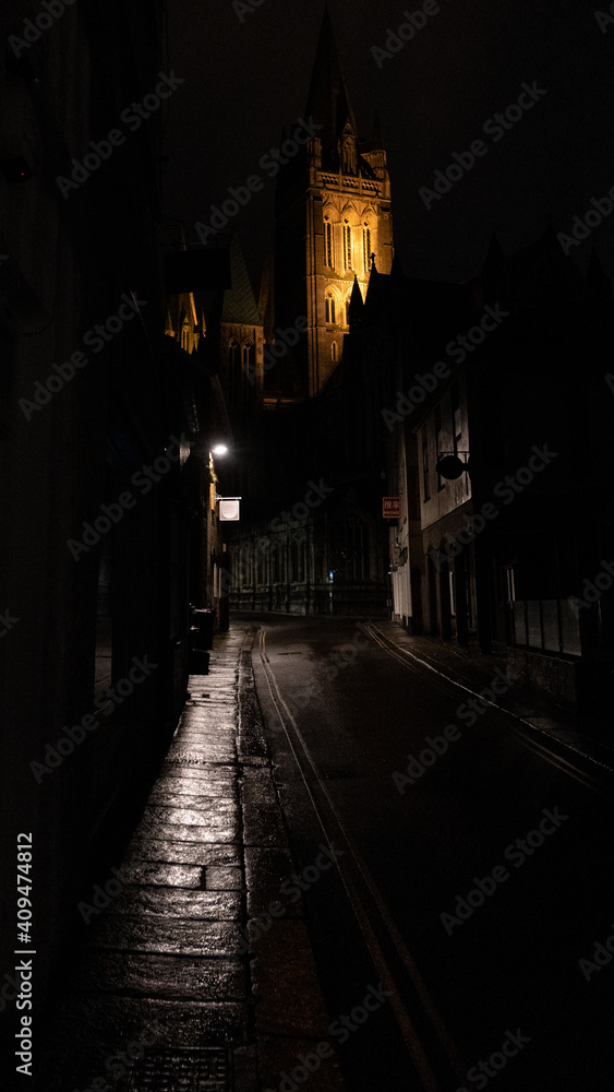 Lit street towards cathedral